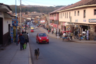 a street with people and cars