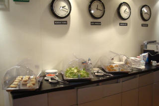 a buffet line with food in plastic containers