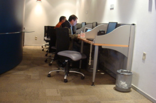 a group of people working on their computers