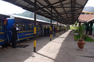 a train station with people waiting
