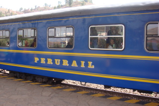 a blue train with yellow lettering