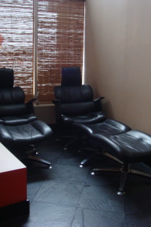 a group of black chairs in a room