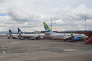 several airplanes parked on a runway