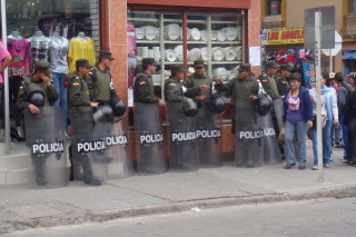 a group of police officers standing outside a store
