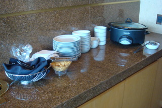 a kitchen counter with plates and bowls