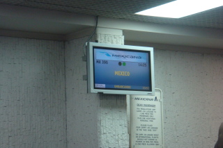 a screen with a sign on the wall