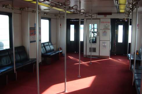 a interior of a train with a red carpet