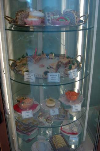 a glass case with food on it