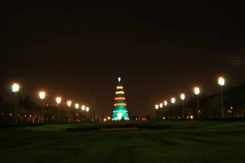 a tall tower with lights at night
