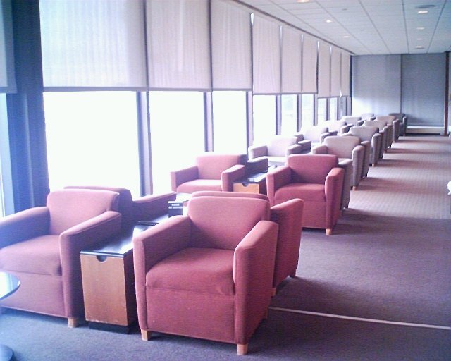 a room with many chairs and tables