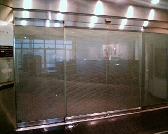 a glass sliding door in a building