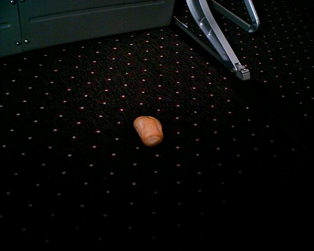 a piece of bread on the floor