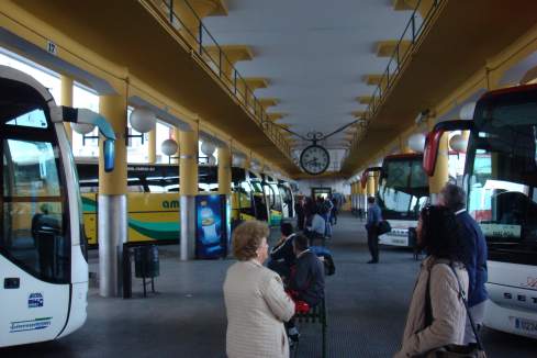 a group of people in a bus station