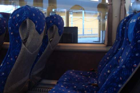 seats in a bus with blue seats