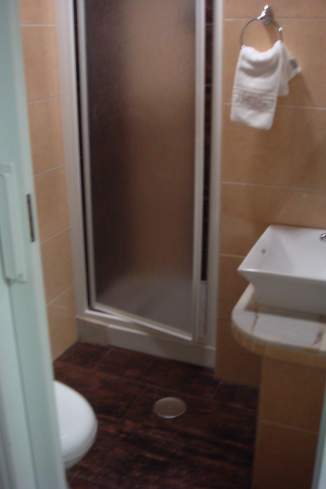 a shower door in a bathroom