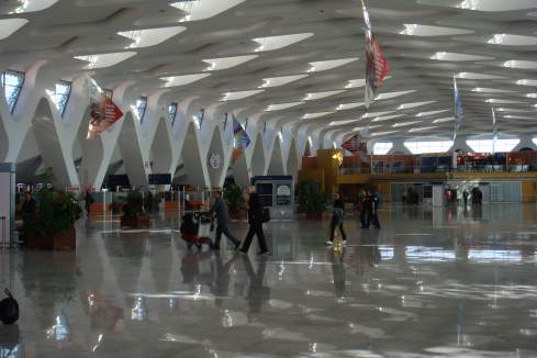 people walking in a large airport