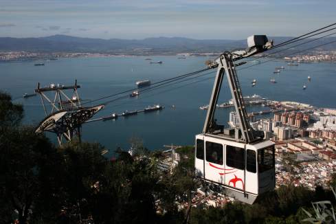 a cable car going over a city