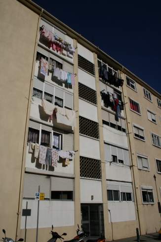 a building with clothes out of the window