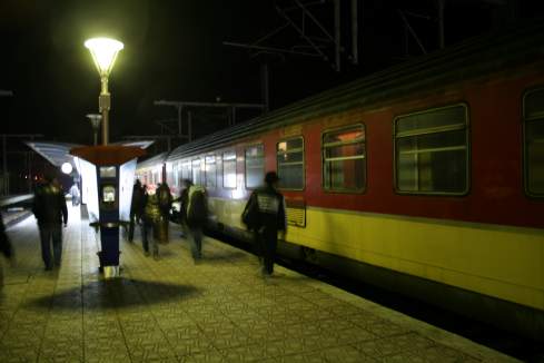 a train at a station at night