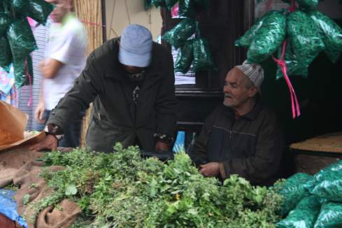 a group of men at a market
