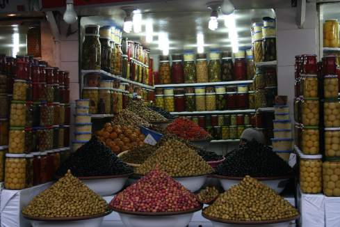 a variety of olives in a market