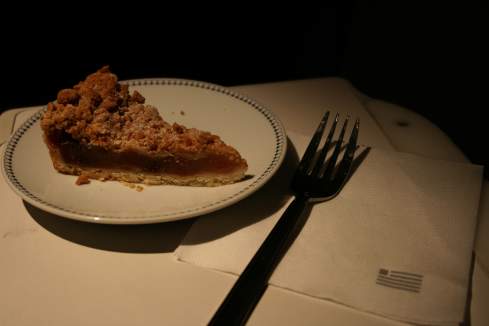 a piece of pie on a plate with a fork