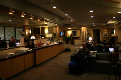 a group of people sitting in a hotel lobby