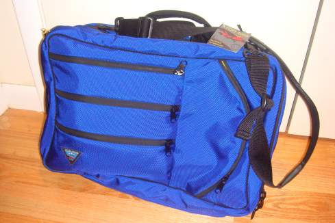 a blue bag with zippers