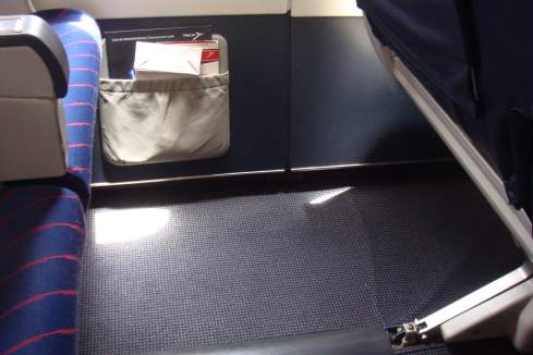 a seat in a plane with a pocket