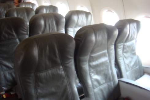 a row of black leather seats