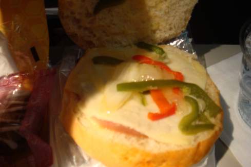 a sandwich with cheese and peppers