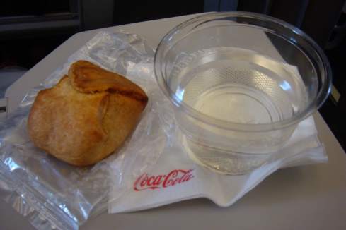 a close-up of a pastry and a plastic container