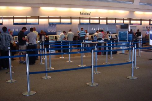 people standing in line at an airport