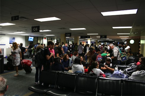 a group of people waiting in a terminal