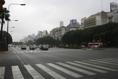 a city street with cars and buildings