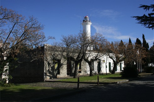 a building with a lighthouse in the background