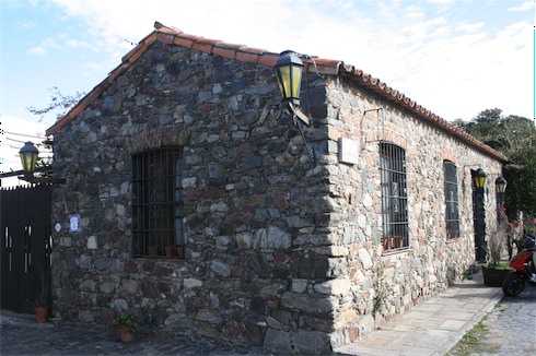 a stone building with a lamp