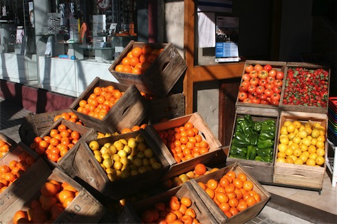 a group of crates of fruit