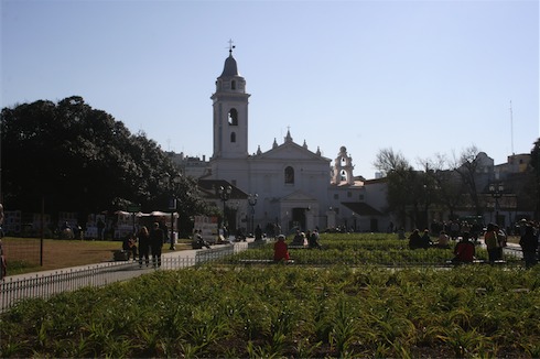 a white building with a bell tower