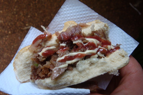 a sandwich with meat and sauce