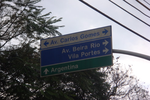 a street sign with arrows