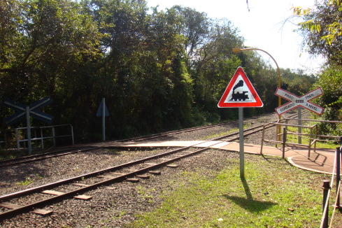 a train tracks with a sign