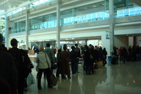 a group of people waiting in a terminal