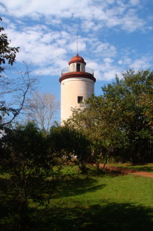 a light house with a red roof