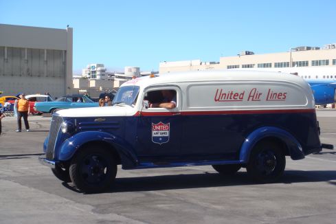 a blue and white van with red and white text