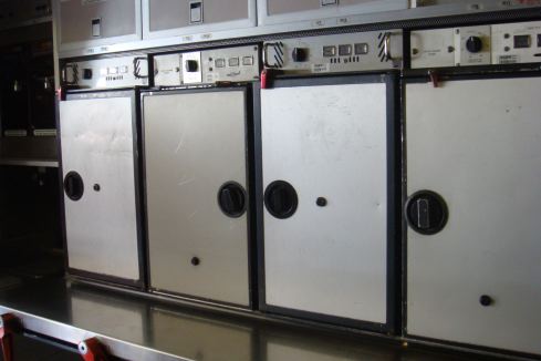 a row of stainless steel refrigerators