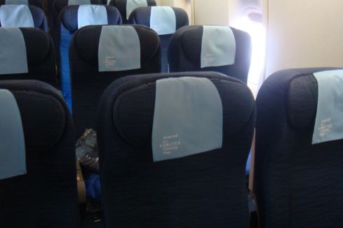 a row of seats with a blue label