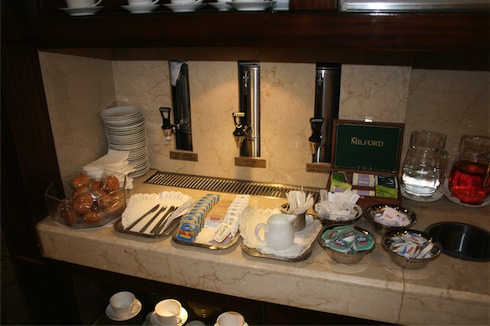 a counter with plates and bowls of food
