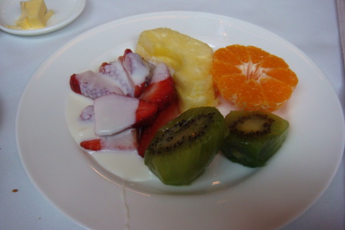 a plate of fruit on a white plate