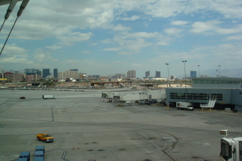 a large airport with a city in the background